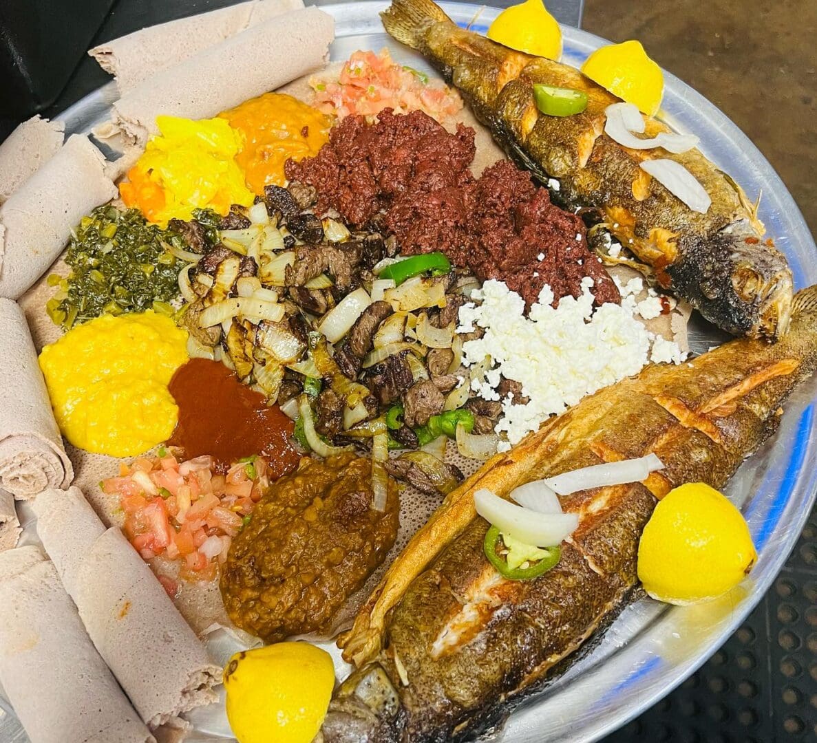 A plate of food with many different types of meat.